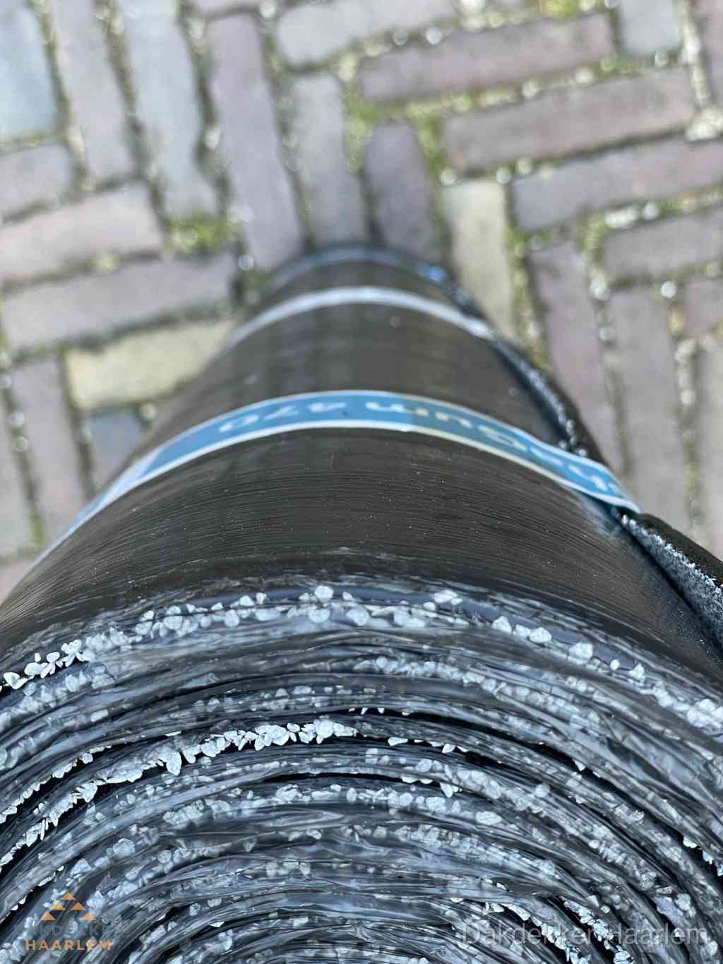 Rol bitumen dakleer met leislag voor plat dak in Haarlem